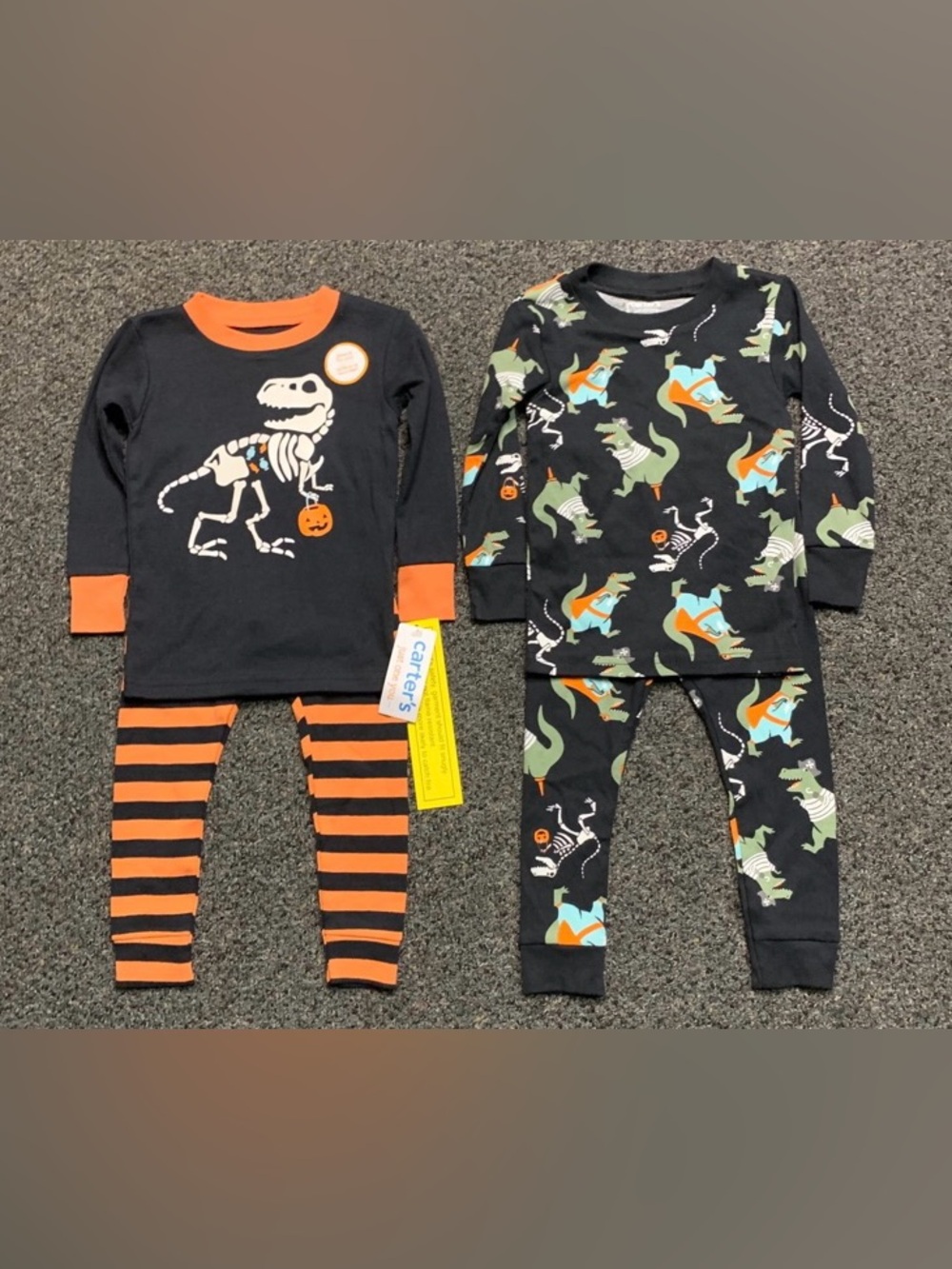 New Carters 2 pair 18 month Halloween dinosaur pajama sets (one glows in the dar